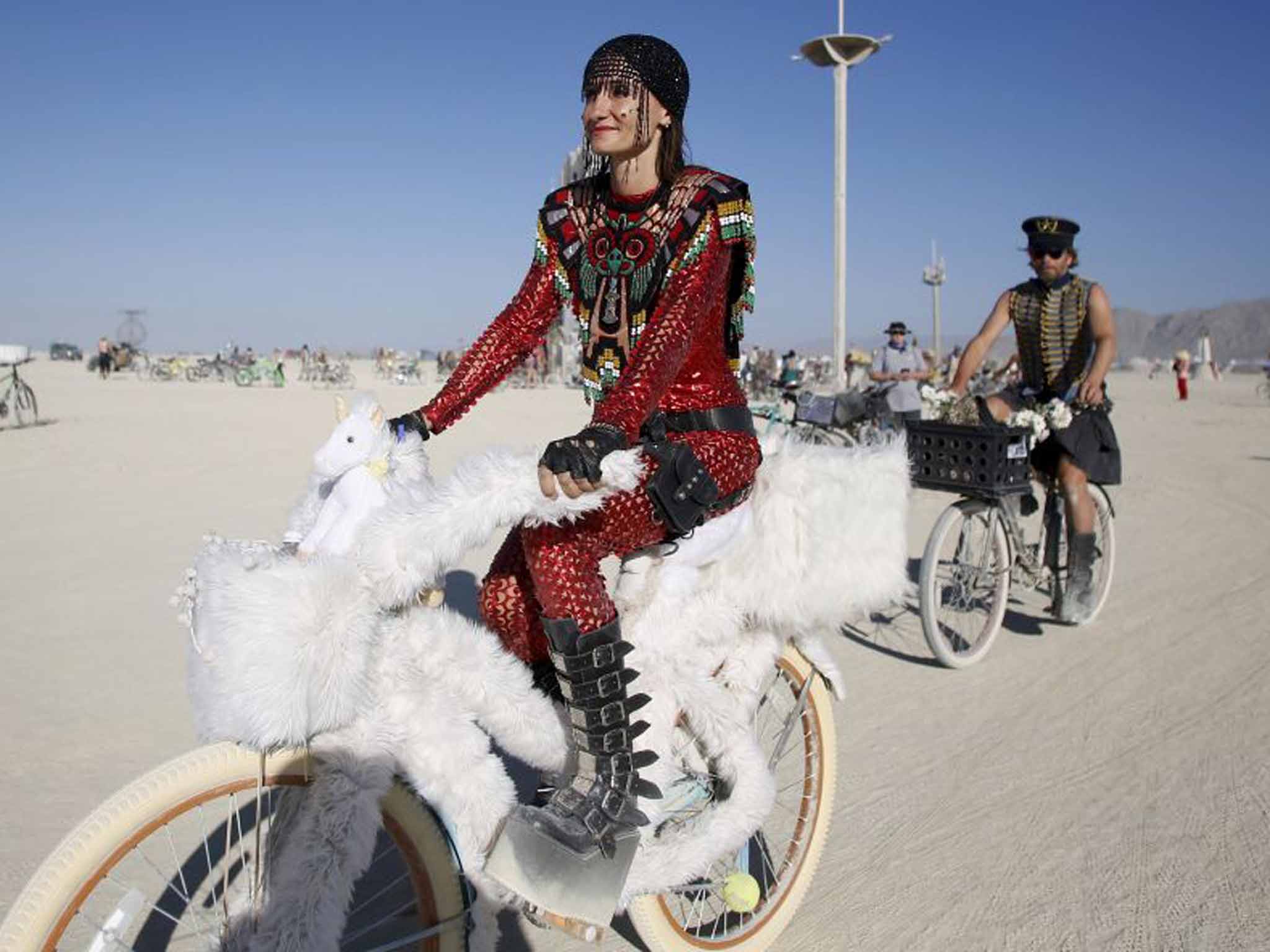 Burning Man's attractions are generally reached by bicycle, whatever the rider's outfit