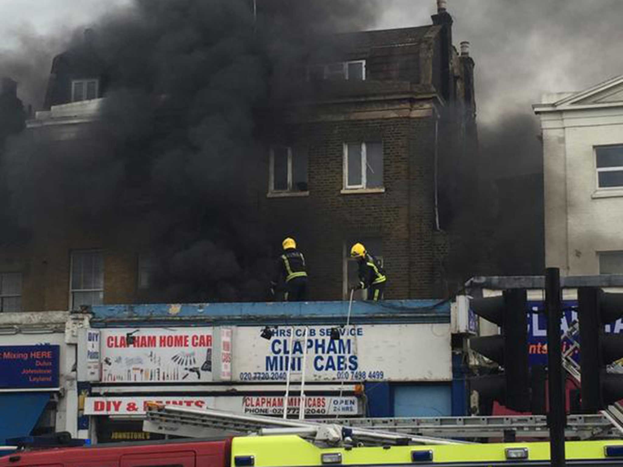 Fire fighters tackle the blaze on the busy high street