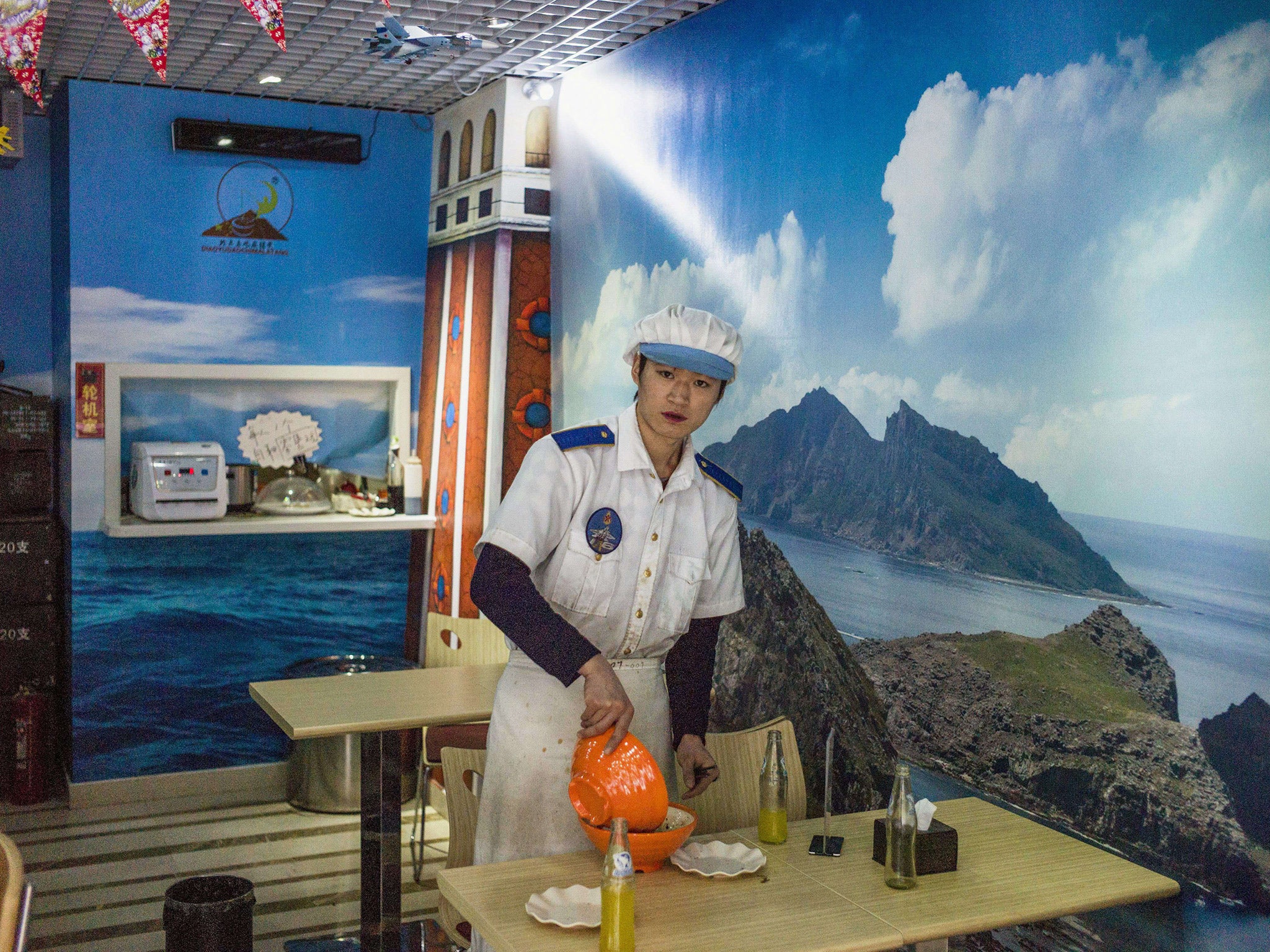 A waiter works at the Malatang Noodle Shop