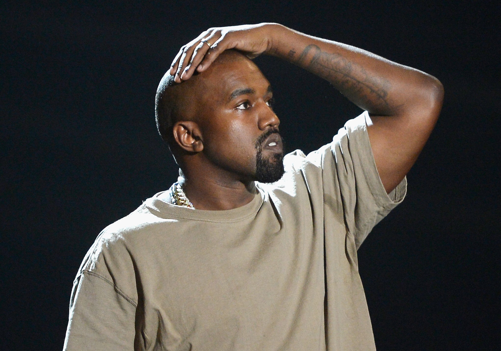 Kanye West accepts the Vanguard Awarda at this year's VMAs.