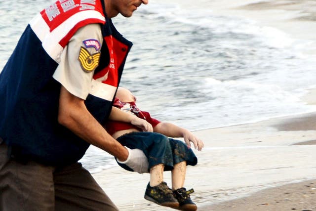 A Turkish rescue worker carries the young boy, who drowned during a failed attempt to sail to the Greek island of Kos (Reuters)