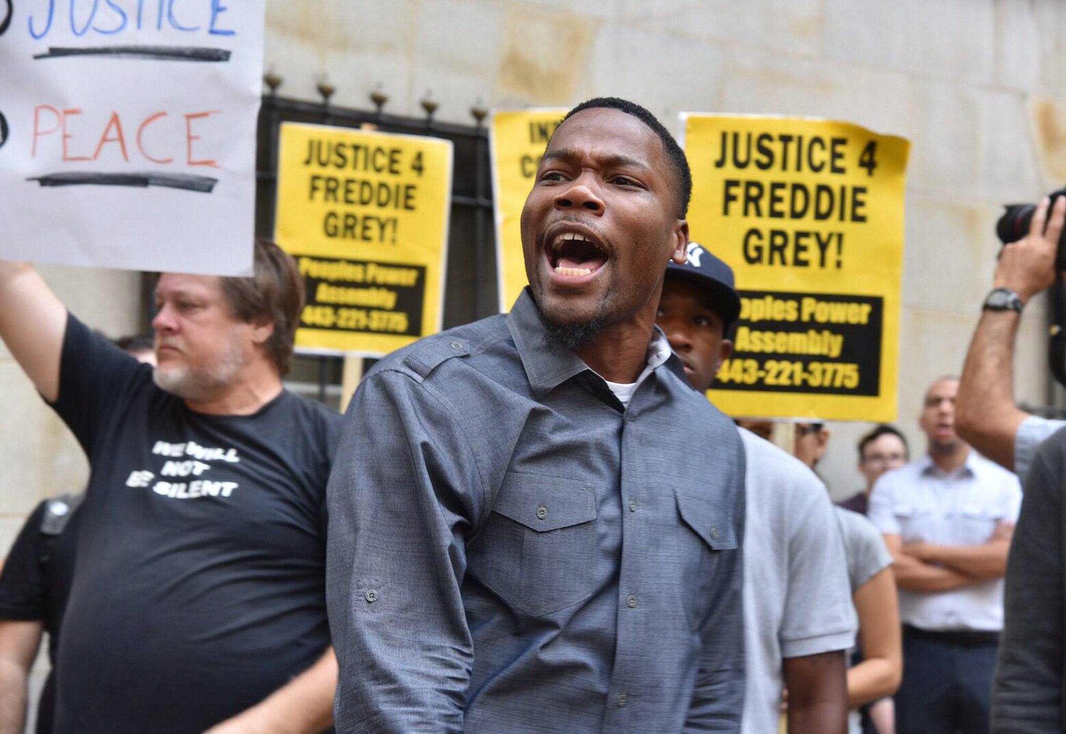 Protesters gather outside Baltimore Circuit Court on Wednesday.