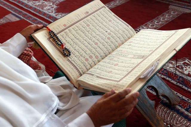 Caption:A Yemeni Muslim worshipper reads the Koran, Islam's holy book, during the fasting month of Ramadan on June 30, 2014 at the Great Mosque in the old city of the capital Sanaa. Ramadan is sacred for the world's estimated 1.6 billion Muslims because it is during that month that tradition says the Koran was revealed to the Prophet Mohammed. AFP PHOTO / MOHAMMED HUWAIS