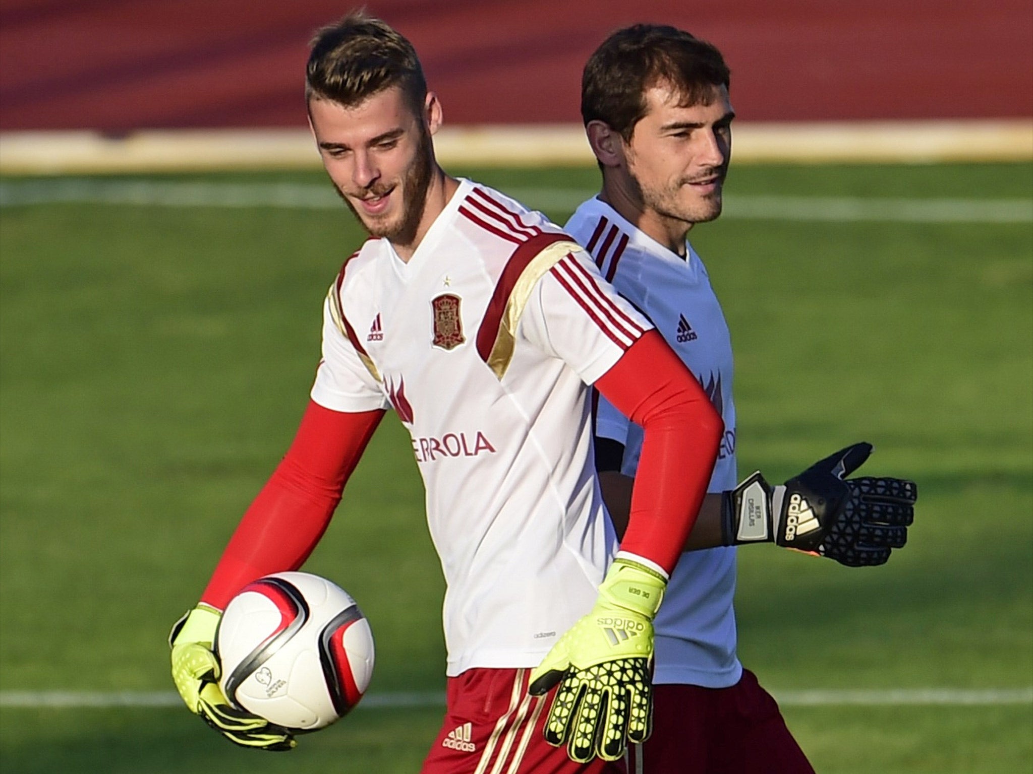 David De Gea shares a joke with fellow Spain goalkeeper Iker Casillas while on international duty