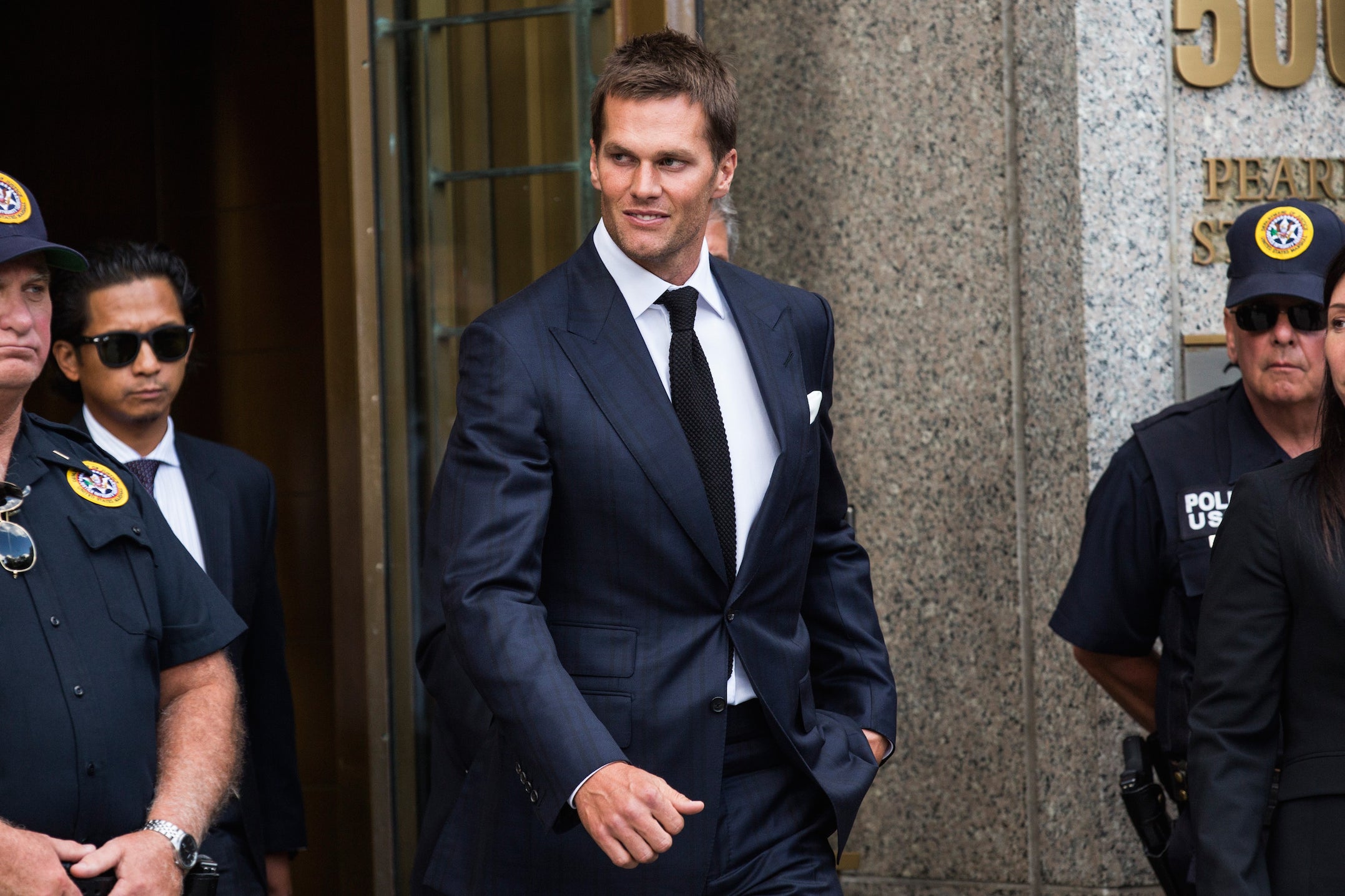 Tom Brady of the New England Patriots leaves federal court in Manhattan on 12 August.