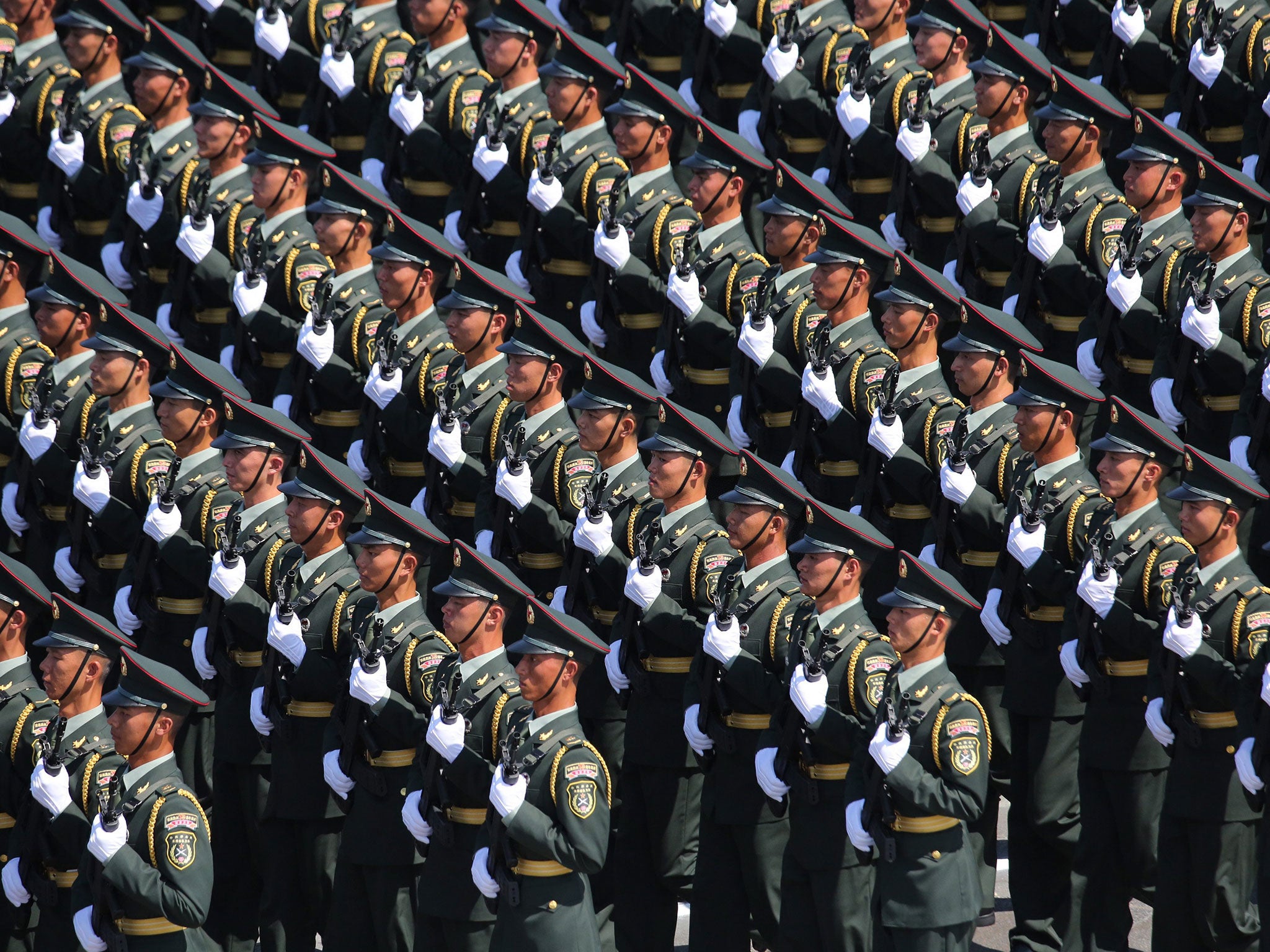 People’s Liberation Army soldiers march on Tiananmen Square at a military parade in Beijing