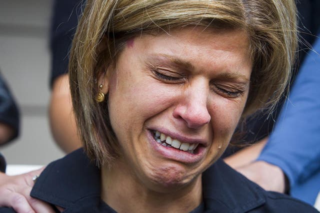 Tima Kurdi, sister of Syrian refugee Abdullah Kurdi whose sons Alan and Galib and wife Rehana were among 12 people who drowned when a boat trying to reach Greece left Turkey, cries while speaking to the media outside her home in Coquitlam, British Columbia