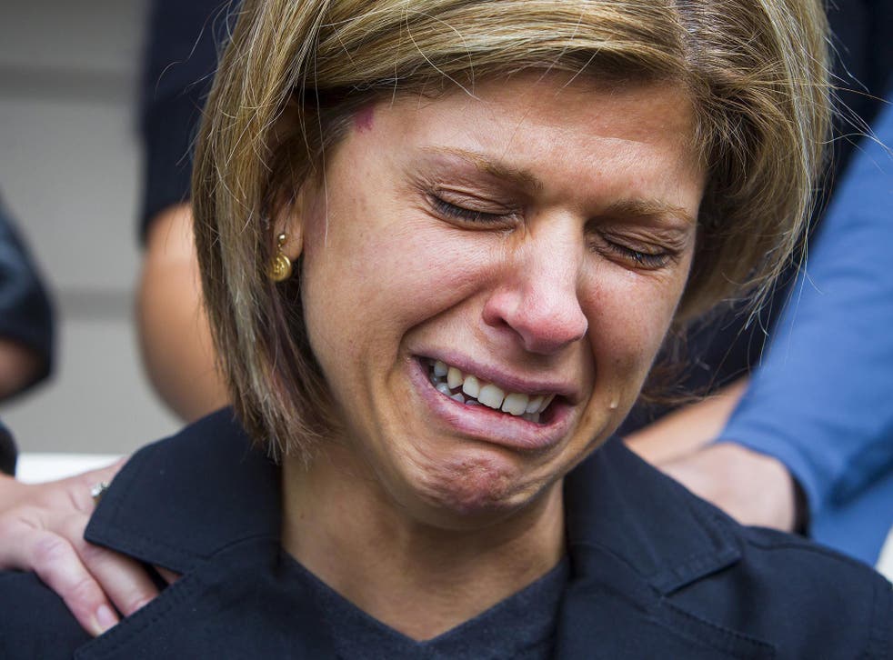 Tima Kurdi, sister of Syrian refugee Abdullah Kurdi whose sons Alan and Galib and wife Rehana were among 12 people who drowned when a boat trying to reach Greece left Turkey, cries while speaking to the media outside her home in Coquitlam, British Columbia
