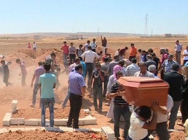 Dozens of mourners gathered in Kobani for the funeral