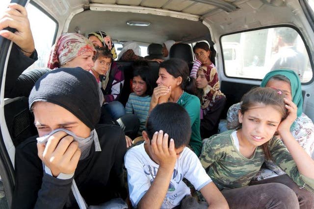 Relatives of the Kurdi family mourning in Kobani