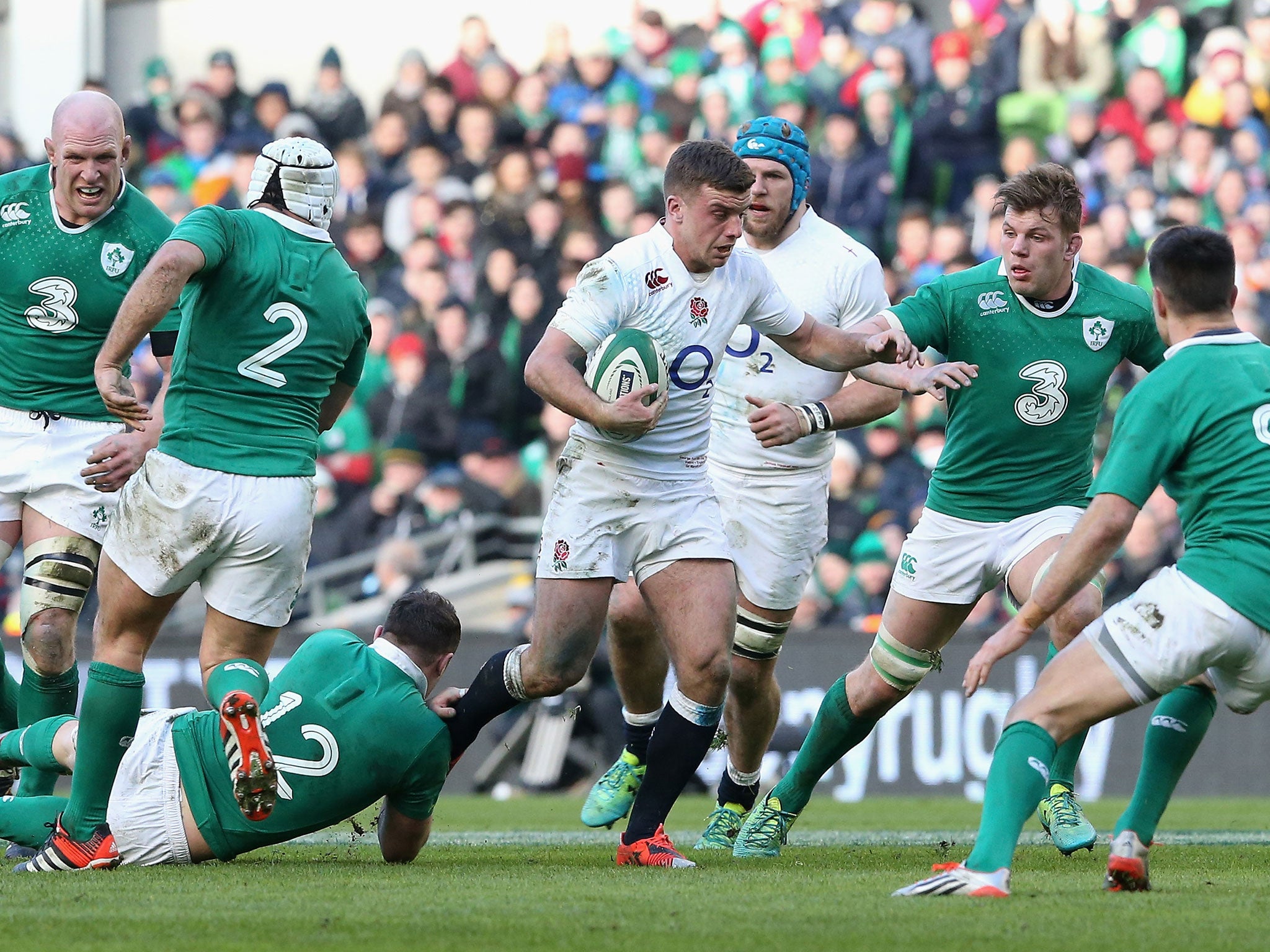 England fly-half George Ford is tackled during the Six Nations match with Ireland