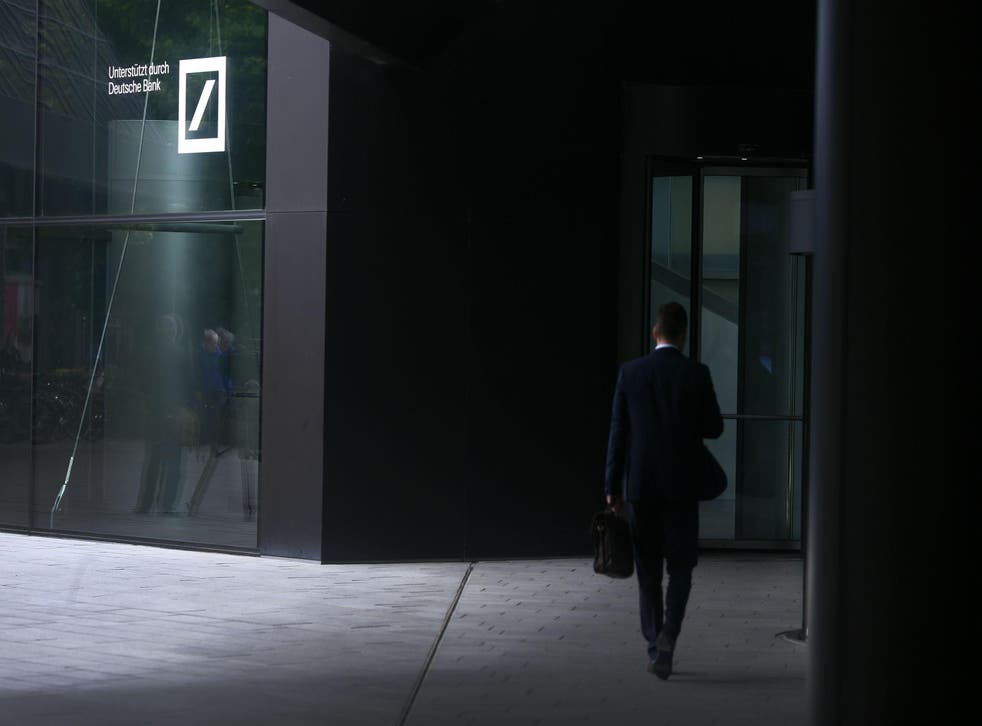 A man enters Deutsche Bank headquarters in Frankfurt, Germany June 9, 2015