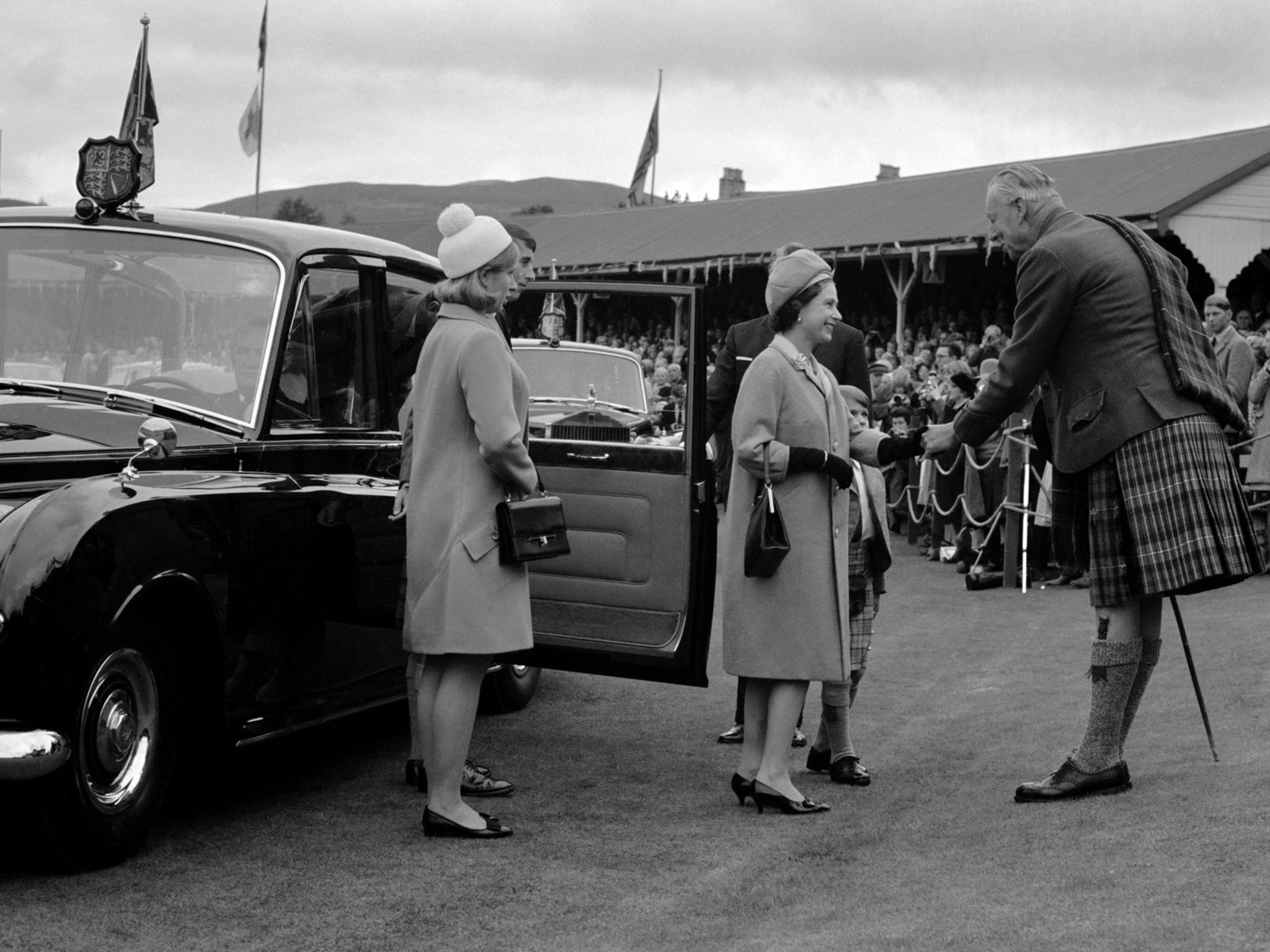 Princess Anne (left) and Queen Elizabeth II (centre) being greeted at the Braemar Highland Gathering in Scotland on 31st August 1967