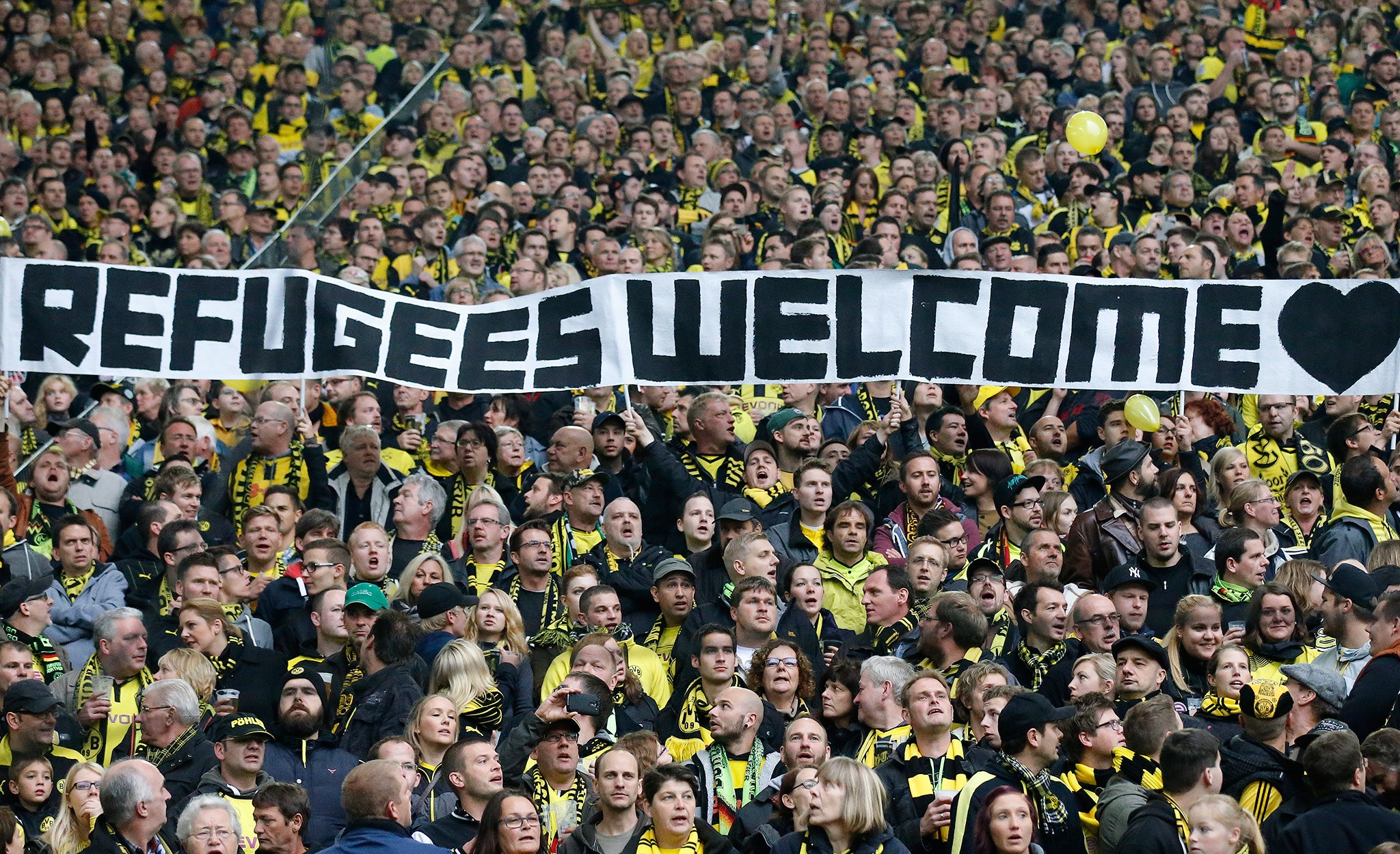 Borussia Dortmund fans unfurl a banner making the stance of the club clear before their Bundesliga match against Hannover 96 last season