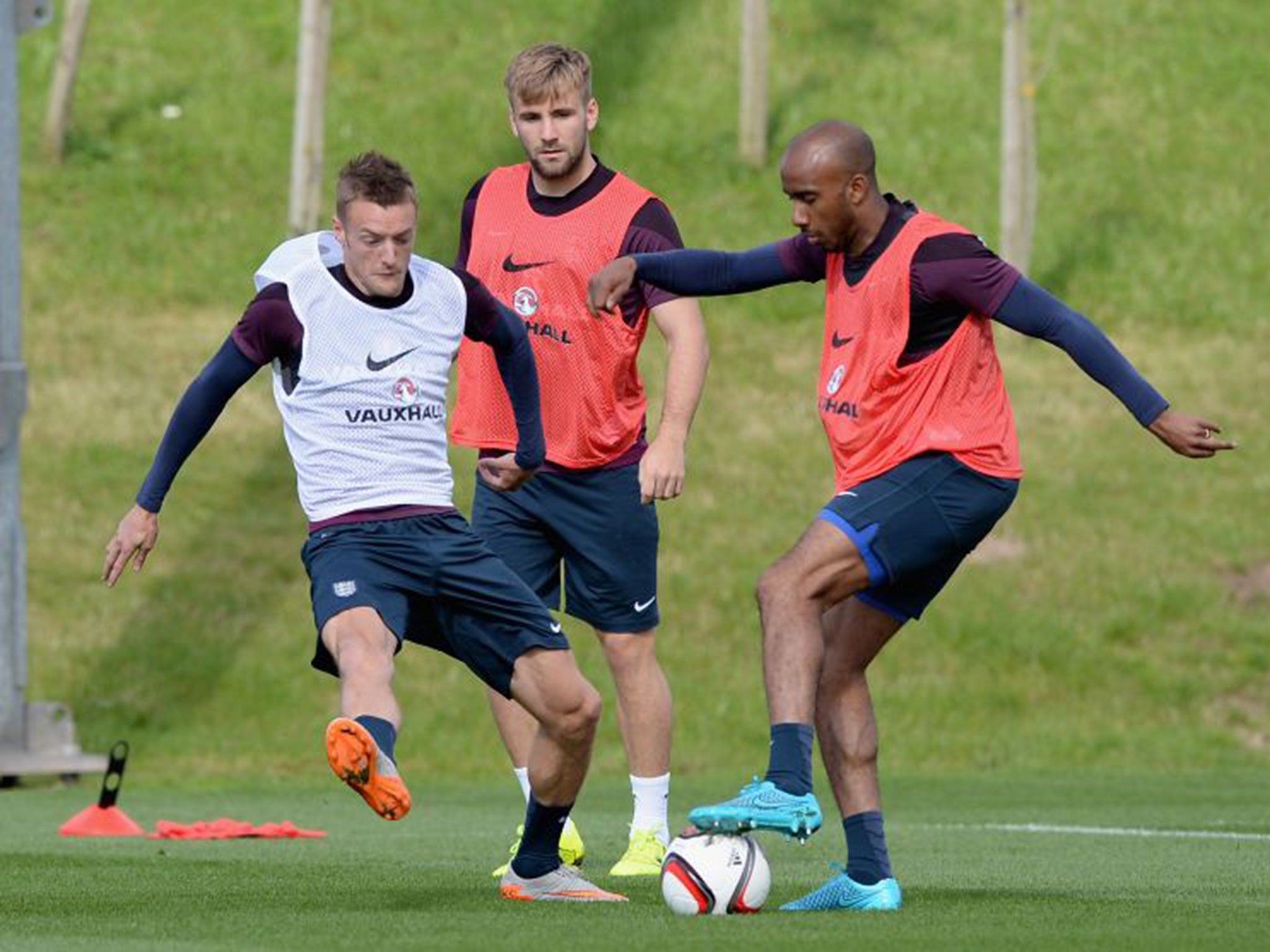 Jamie Vardy (left) gets stuck in during England training