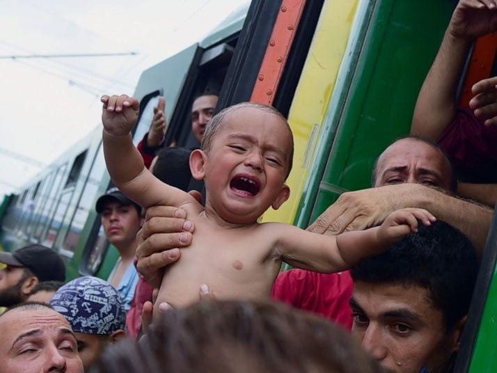 Young children were among hundreds of refugees who crammed on the first trains towards Austria as authorities let them leave Budapest