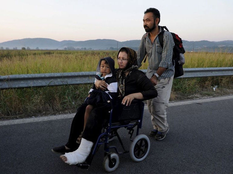 An Afghan family make their way towards Europe on the Balkans route through Macedonia