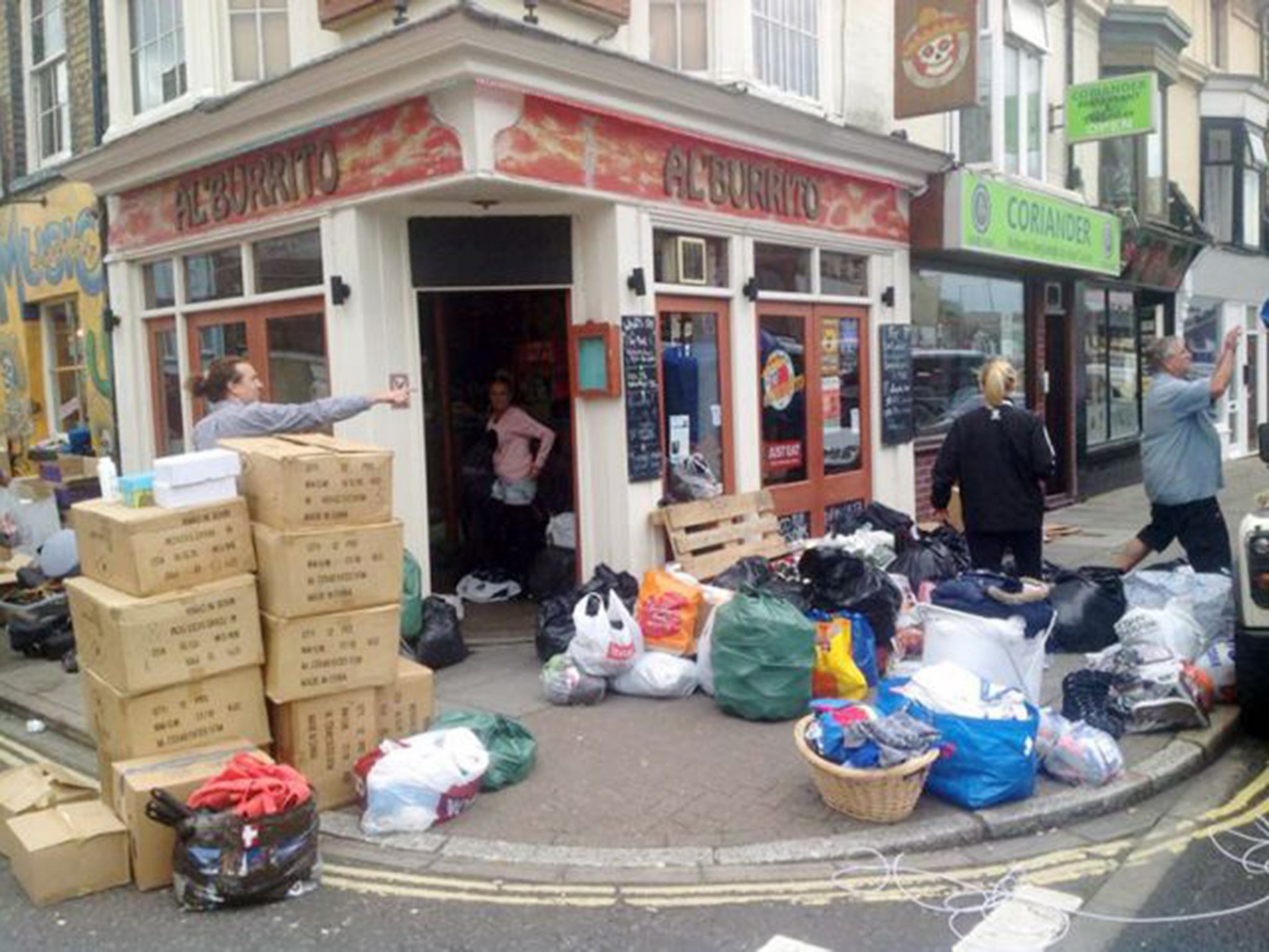Staff and friends of the Alíburrito bar in Southsea, Portsmouth gathering supplies to take across to Calais