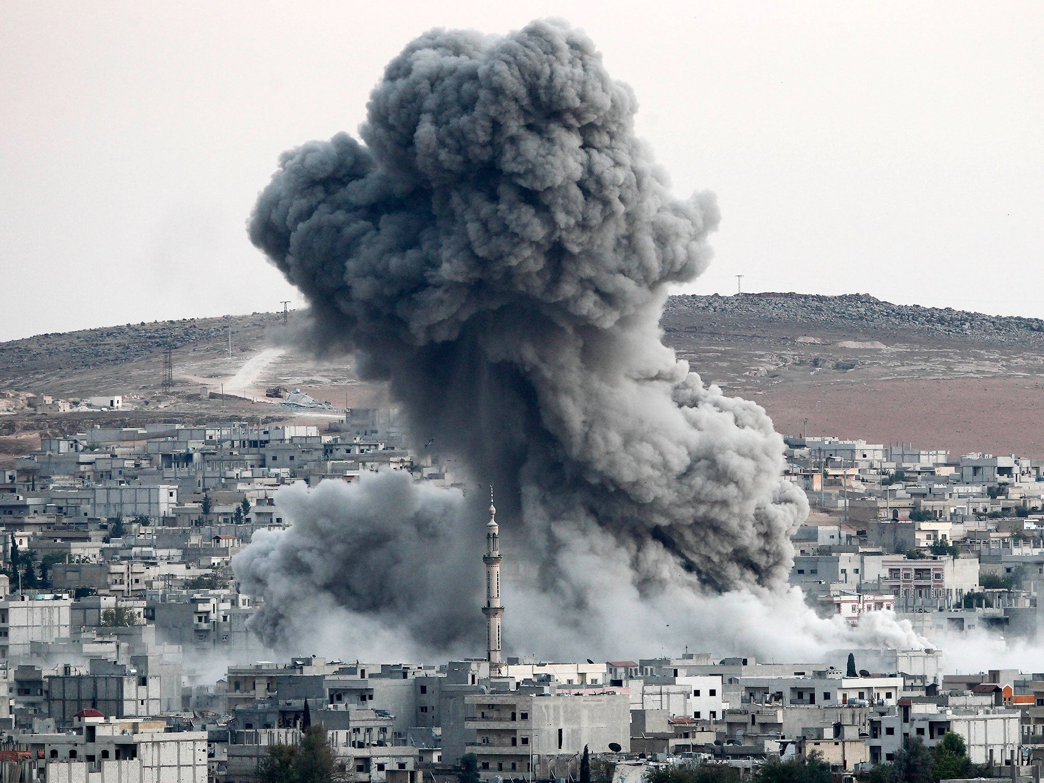 David Cameron wants to join the US-led coalition in bombing targets in Syria, such as this airstrike on Kobani, a key battleground between Isis and Syrian Kurds