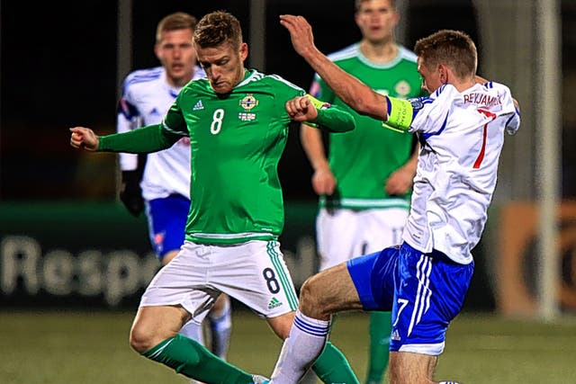 Steven Davis (left) in action for Northern Ireland in the 3-1 win over the Faroe Islands in Torshavn on Friday