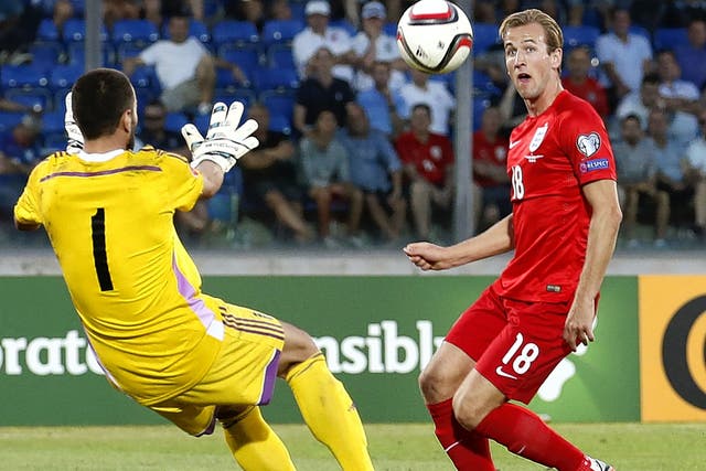 Harry Kane lobs the San Marino goalkeeper to score on Saturday night