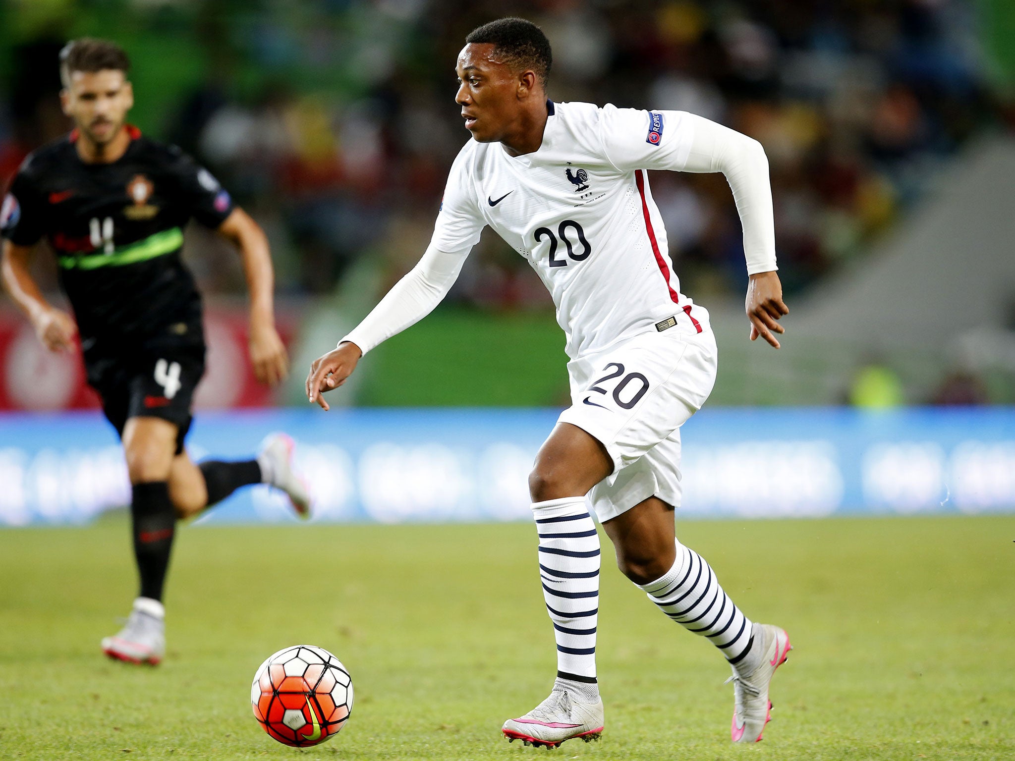 Anthony Martial runs with the ball during his France debut on Friday