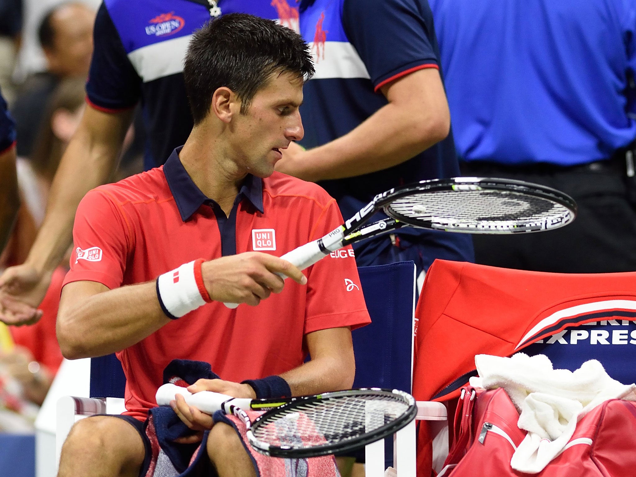 Novak Djokovic with a broken racket after stamping on it in frustration
