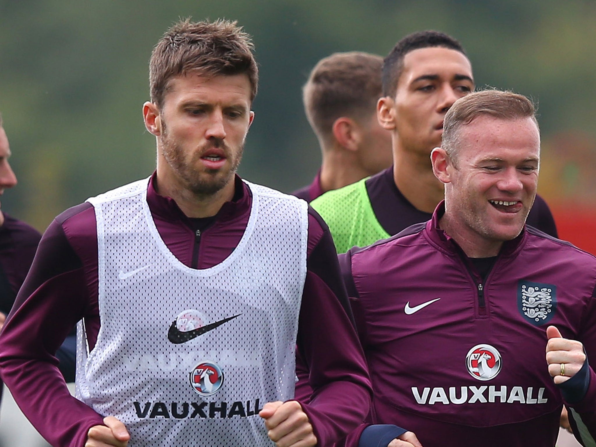 Michael Carrick alongside Wayne Rooney during England training