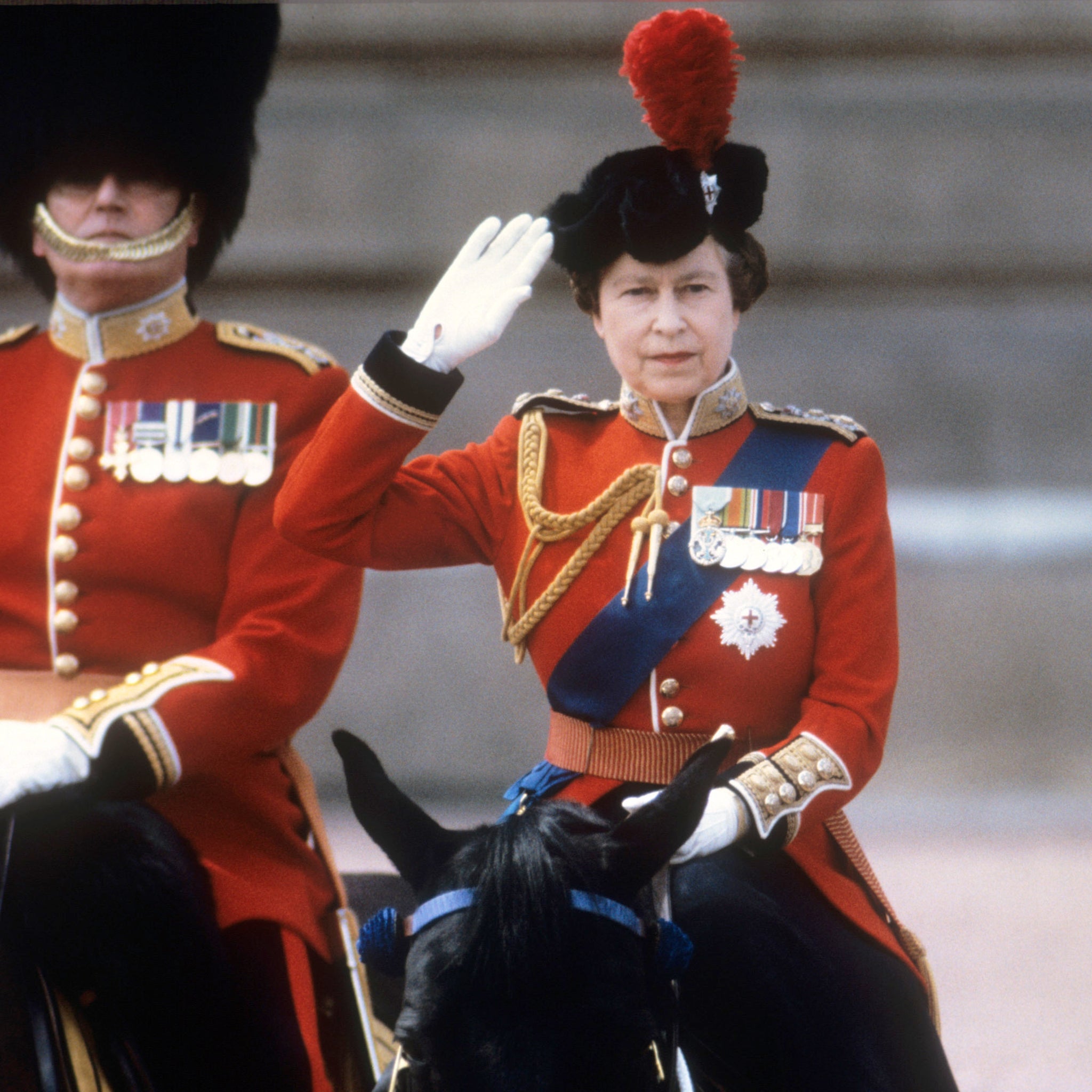 Queen Elizabeth II taking the salute of the Household Guards regiments during the Trooping of the Colour ceremony in London, 1985