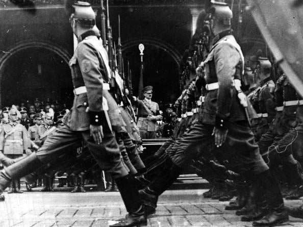 Nazi police march past Hitler in Nuremberg in 1940