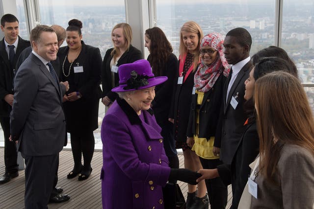 Queen Elizabeth II meets young people during an official visit to The Shard building in central London, 2013