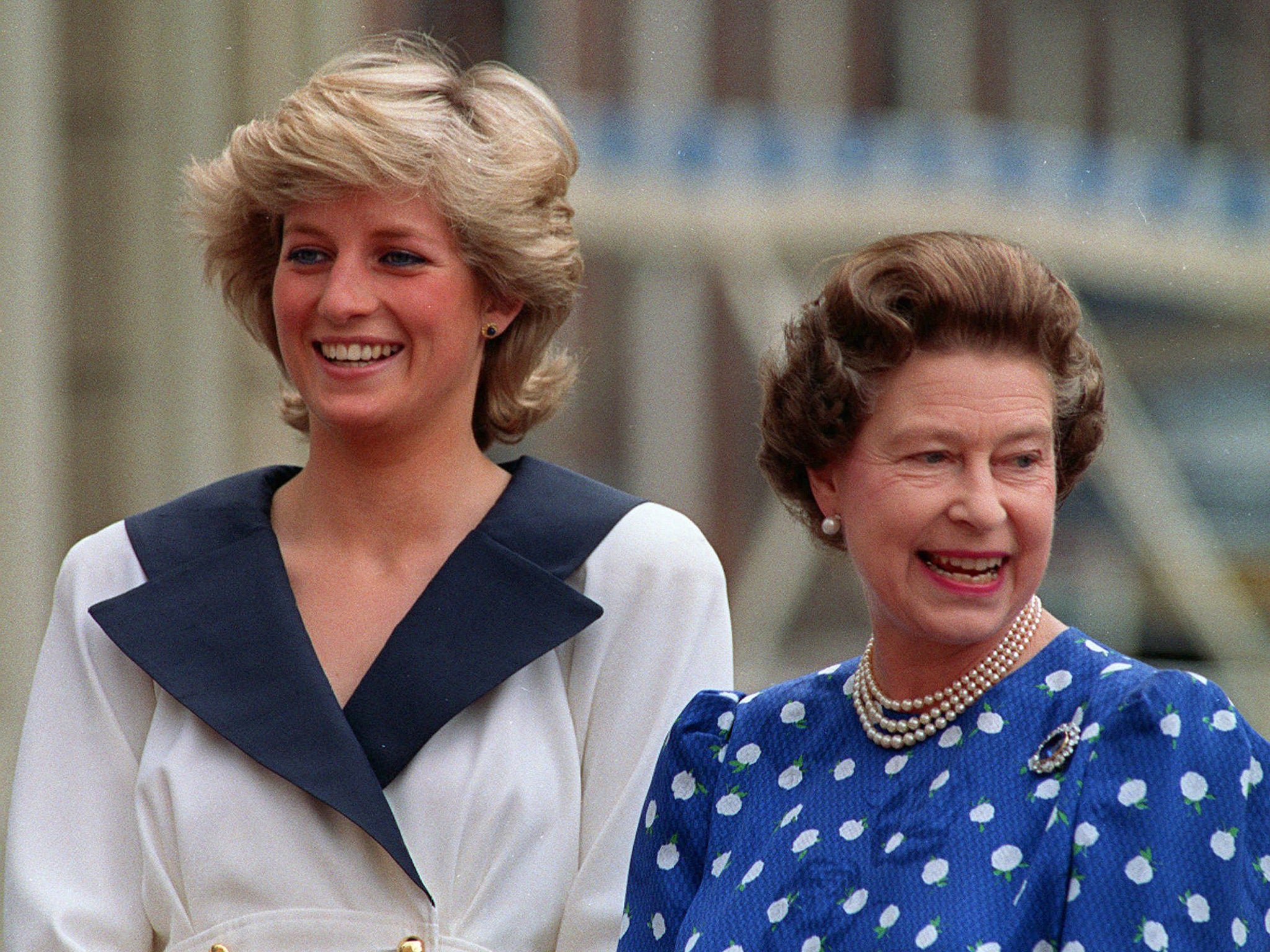 Diana, Princess of Wales and Queen Elizabeth II smile to well-wishers outside Clarence House in London, 1987