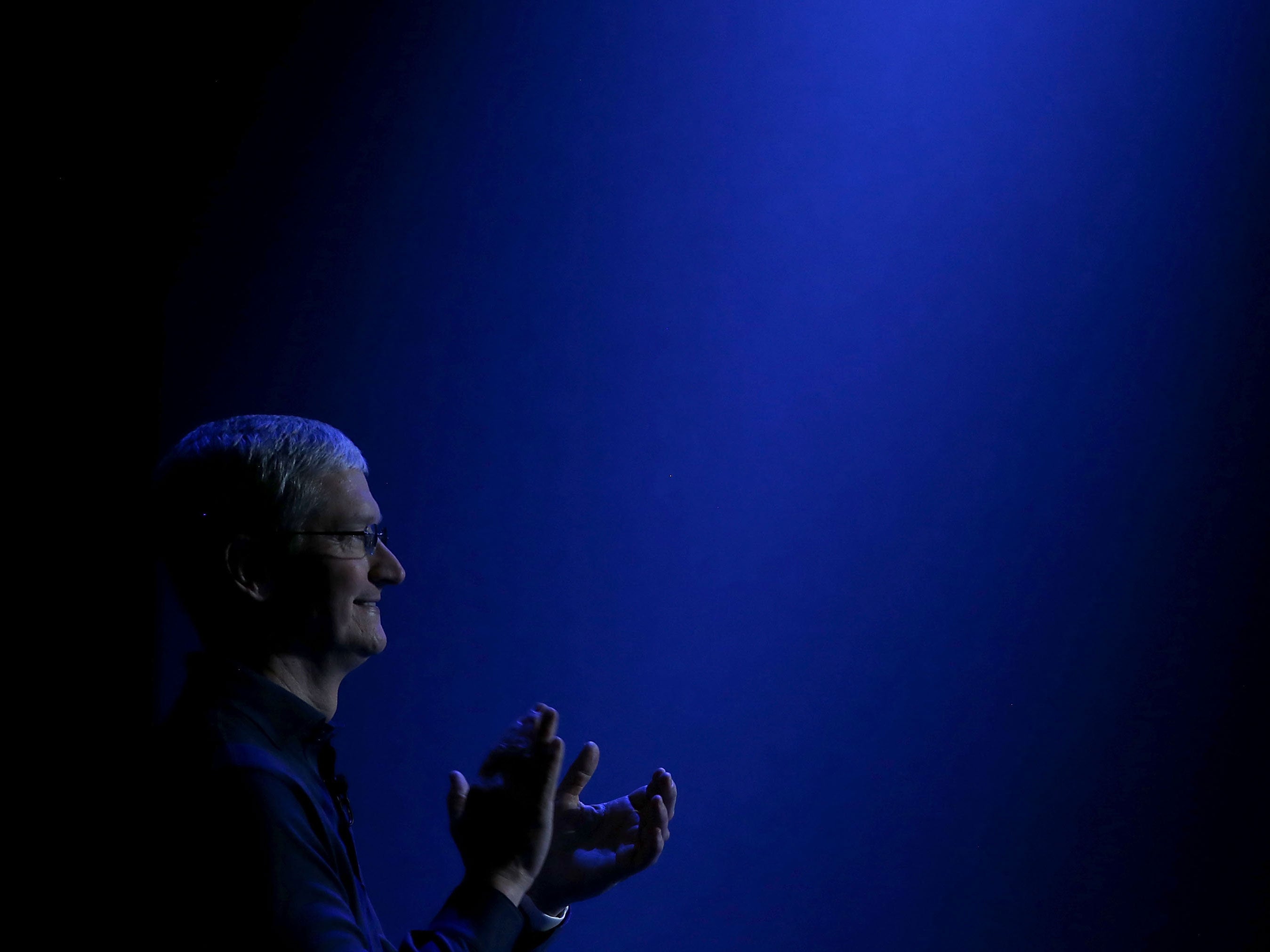 Apple CEO Tim Cook looks on as he delivers the keynote address during Apple WWDC on June 8, 2015 in San Francisco, California