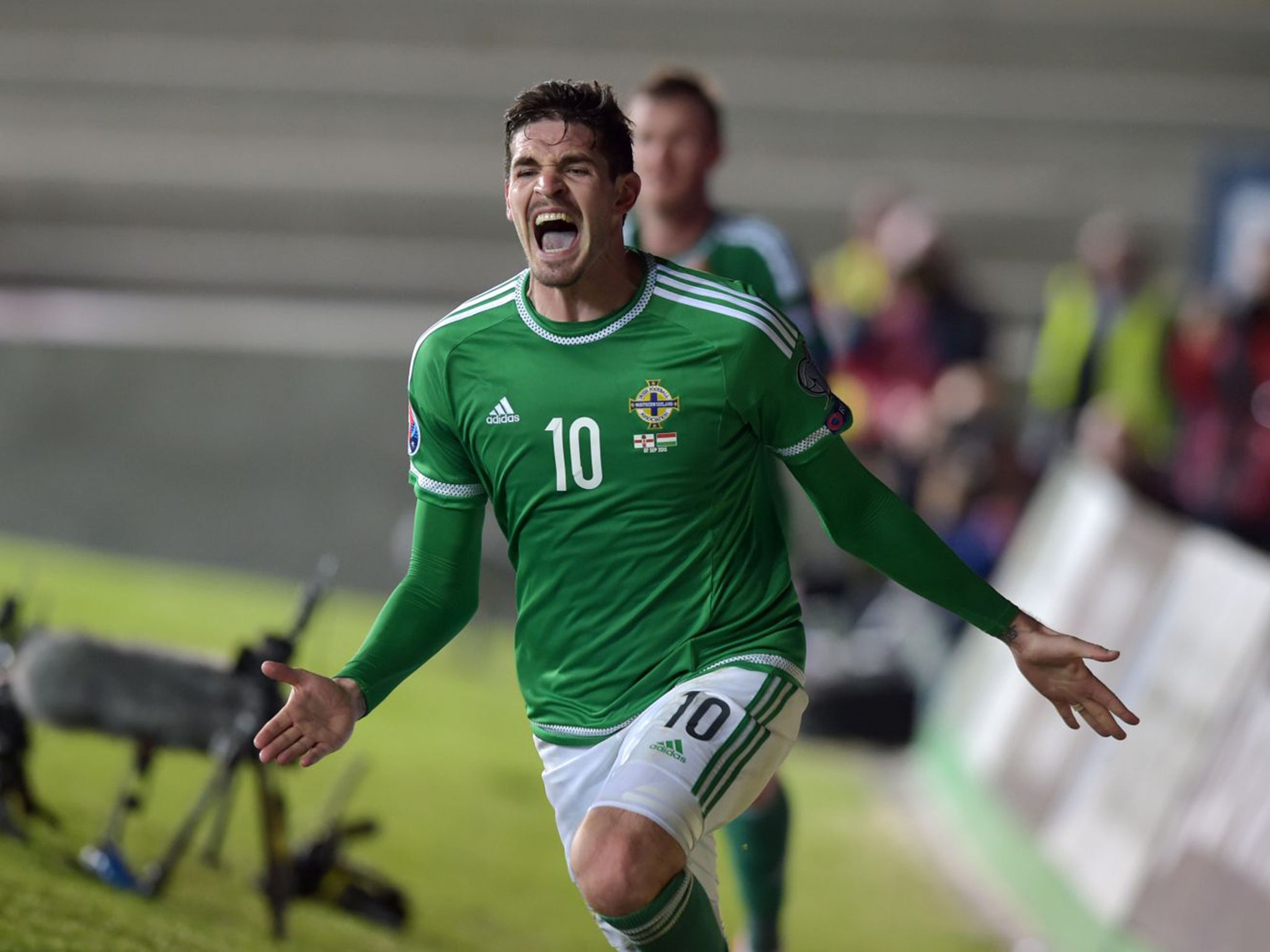 Kyle Lafferty celebrates scoring 10-man Northern Ireland’s equaliser deep in injury time as they salvaged a vital 1-1 draw against Hungary at Windsor Park