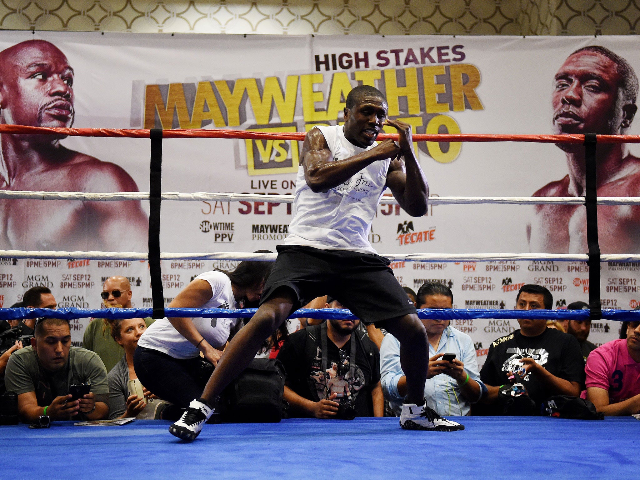 Andre Berto holds a media workout