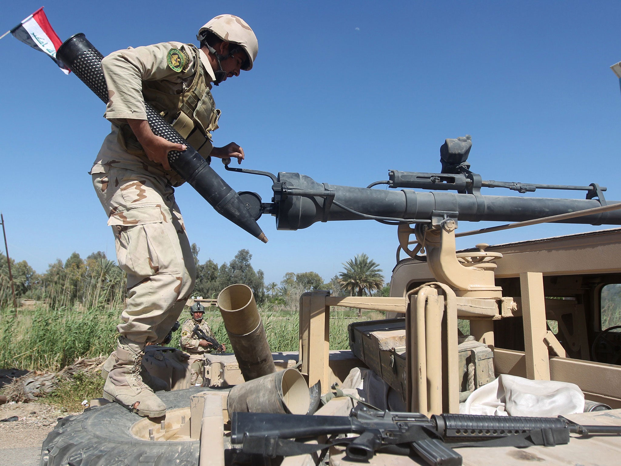 Iraqi forces prepare to fire artillery towards Isis group positions in the Garma district, west of Baghdad, in April 2015.