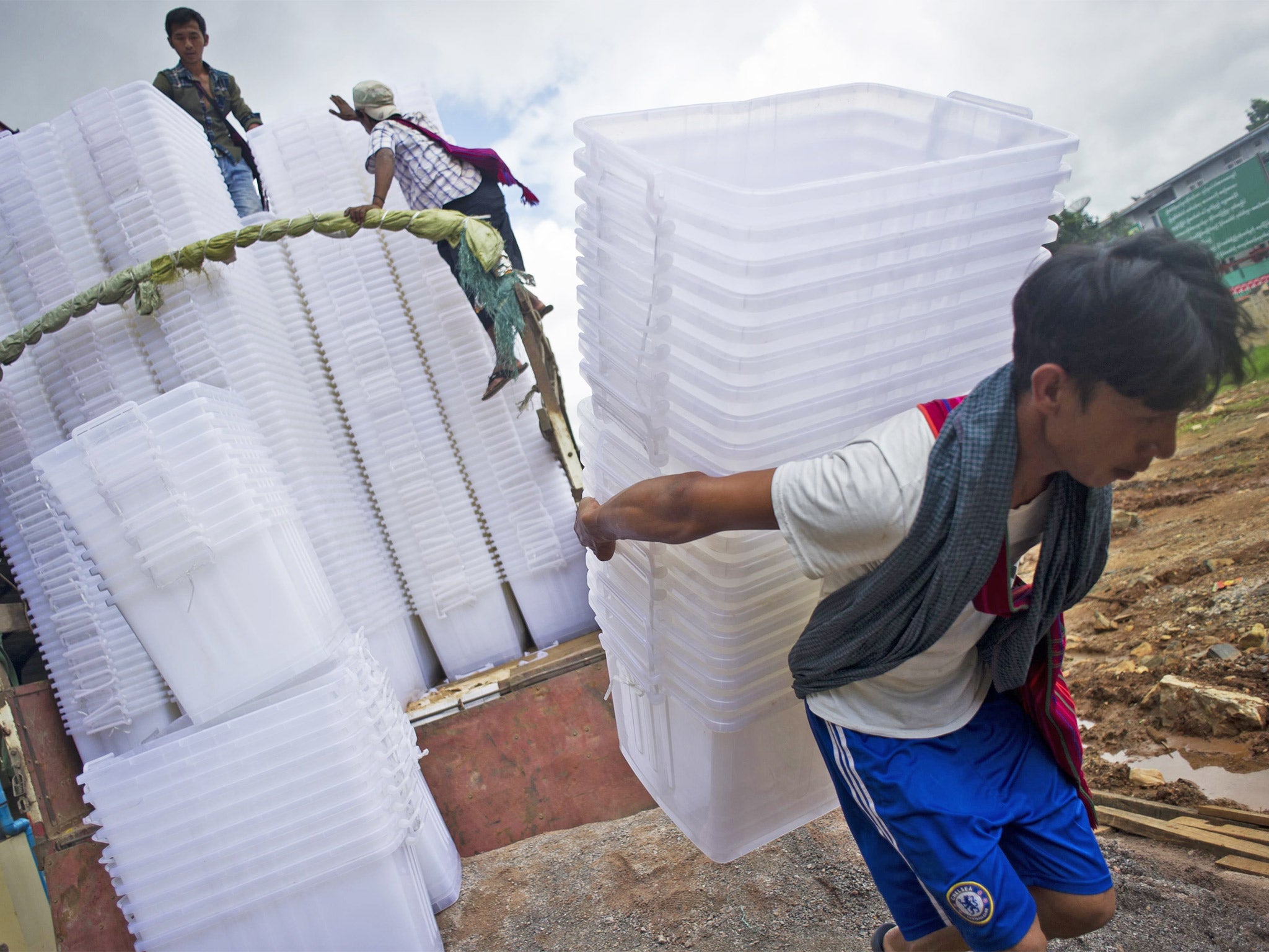 Workers unload ballot boxes in Taung Gyi stadium, Shan State, Burma (Getty)