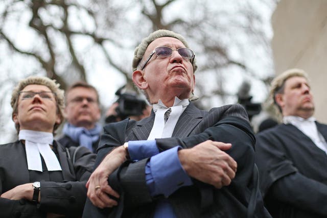 Barristers demonstrate against legal aid cuts outside Parliament last year