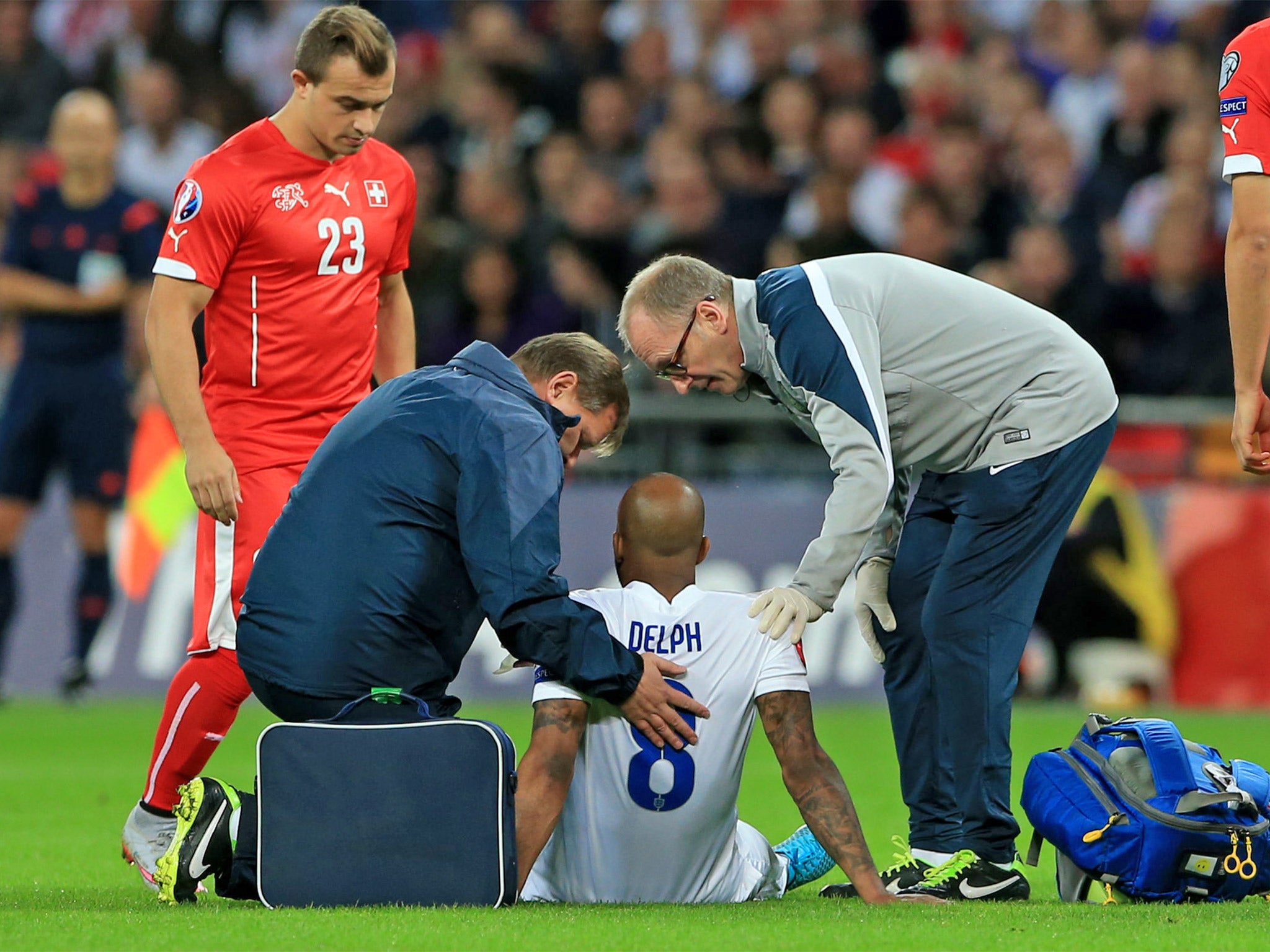 Fabian Delph receives treatment on the pitch