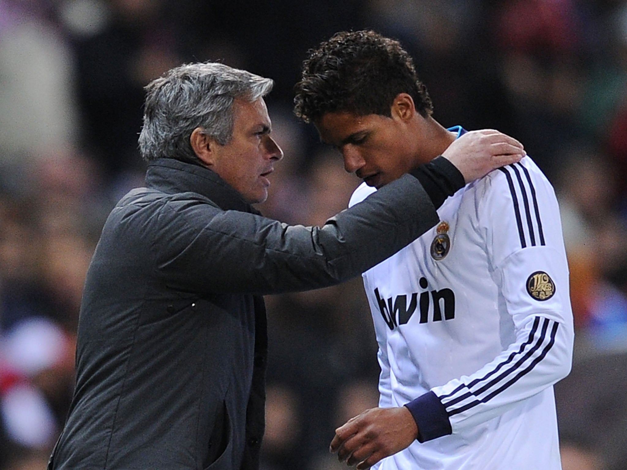 Jose Mourinho with Raphael Varane