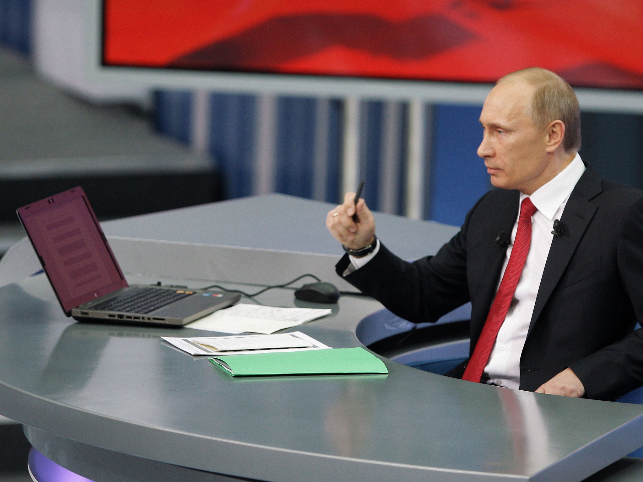 Russian Prime Minister Vladimir Putin speaks during his annual TV marathon question-and-answer session with Russians in Moscow, on December 16, 2010
