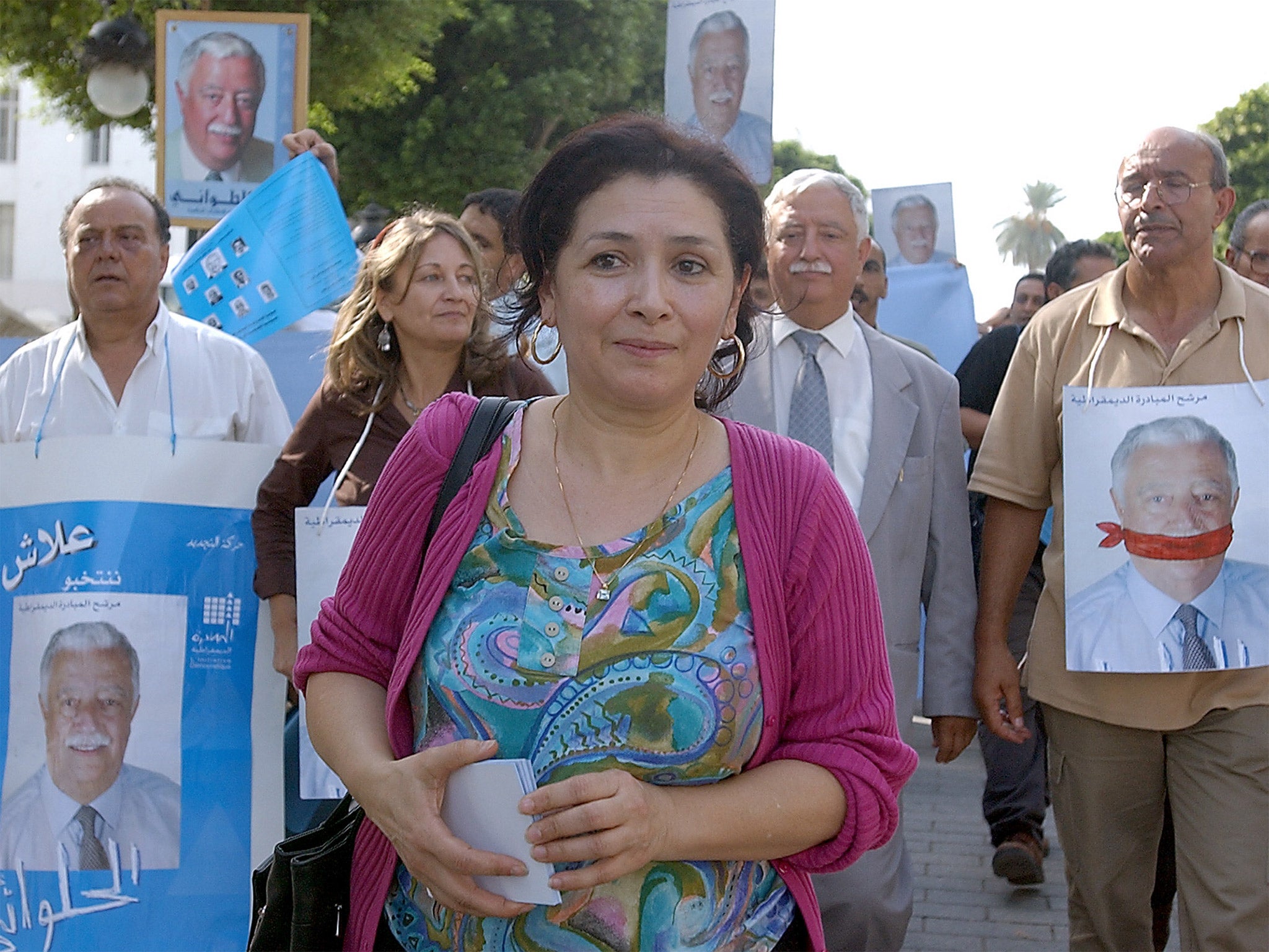 The human-rights activist Sihem Bensedrine and supporters of the electoral candidate Mohamed Ali Halouani protest against the former Tunisian President Zine Ben Ali in 2004