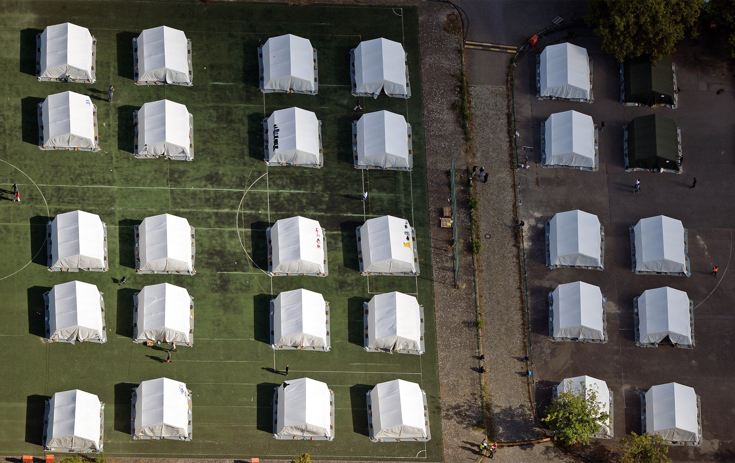 Refugees are housed in tents on the premises of the former Schmidt-Knobelsdorf barracks, in Berlin