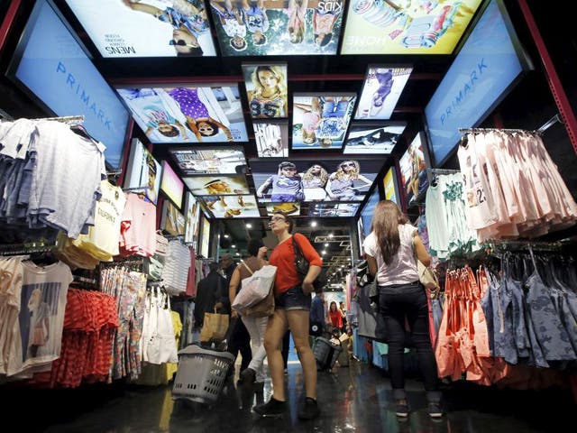 Customers shop at a Primark store on Oxford Street in London, England