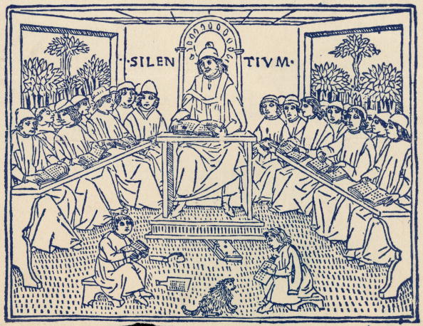 Medieval scholars attend a lecture, circa 1400. The inscription behind the lecturer reads: 'Silence'