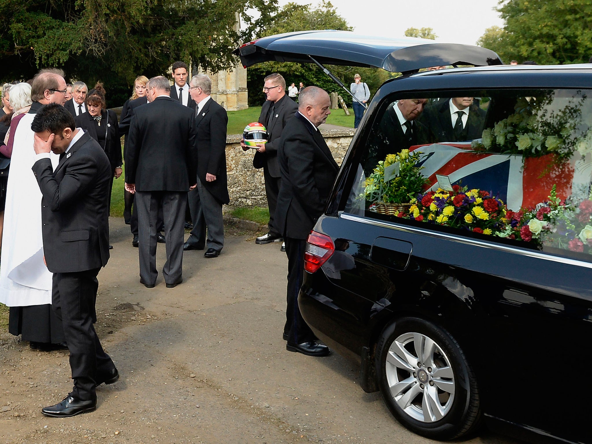 The coffin of Justin Wilson sits in the hearse after his funeral at St James the Great Church in Paulerspury