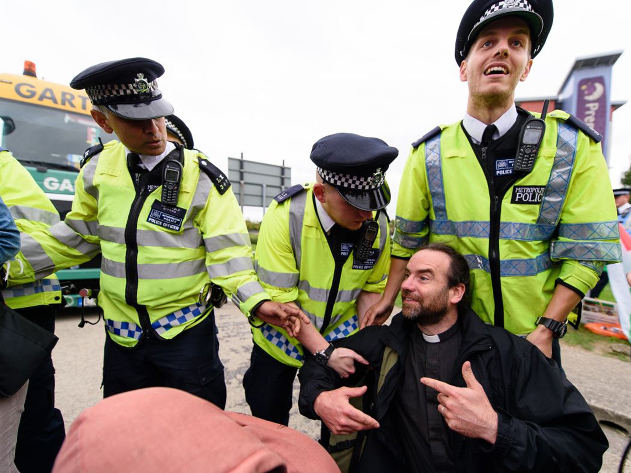 A protester is removed by police from a group highlighting their opposition to Israel’s actions against Palestine