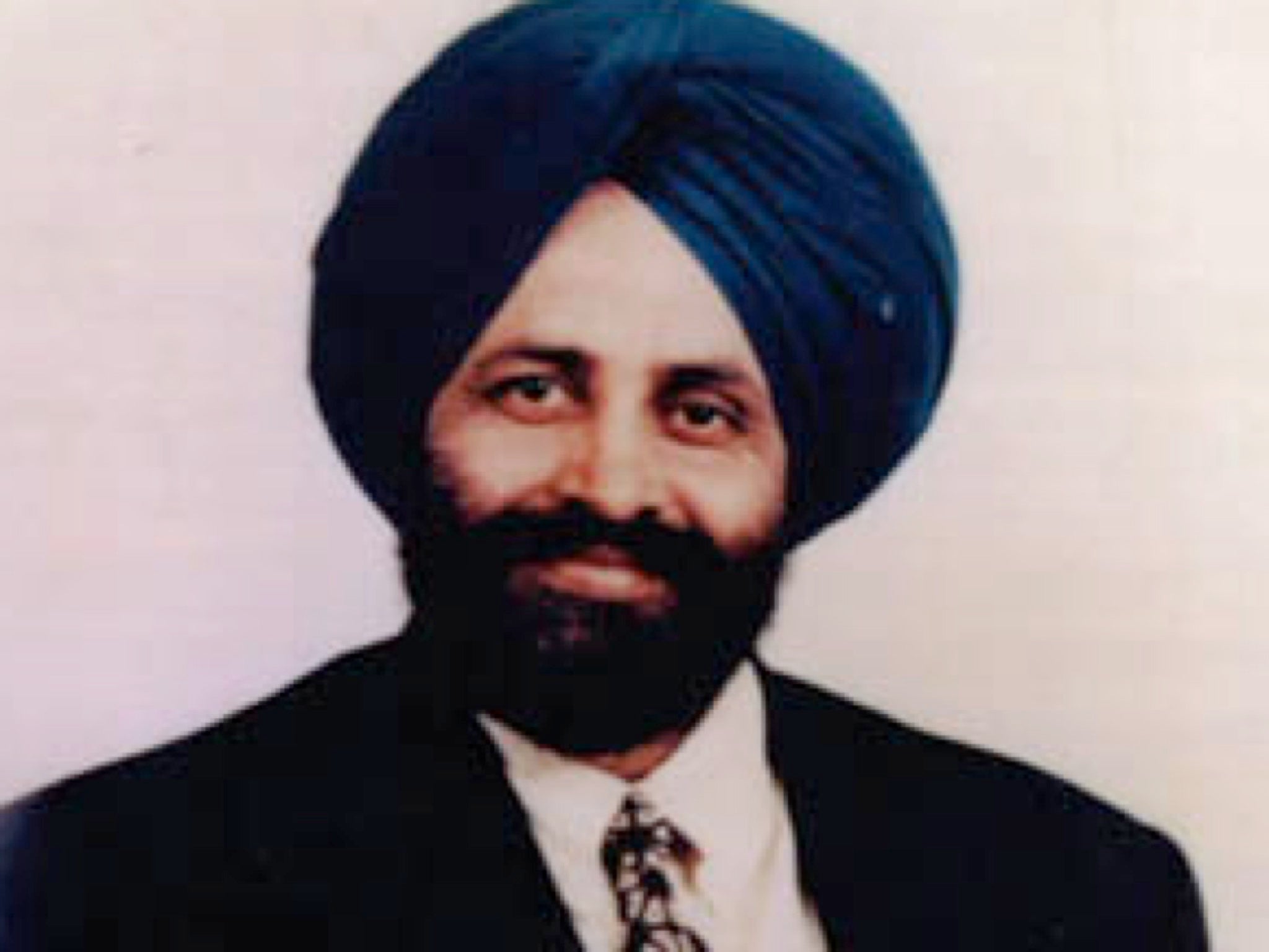 A portrait of Balbir Singh Sodhi.
