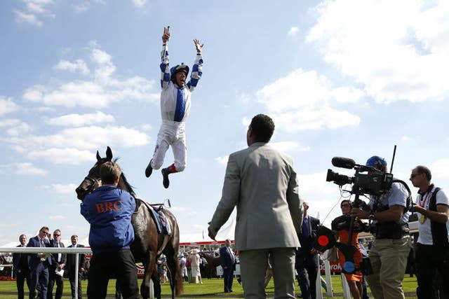 Frankie Dettori performs a flying dismount after winning on Nemoralia at Doncaster