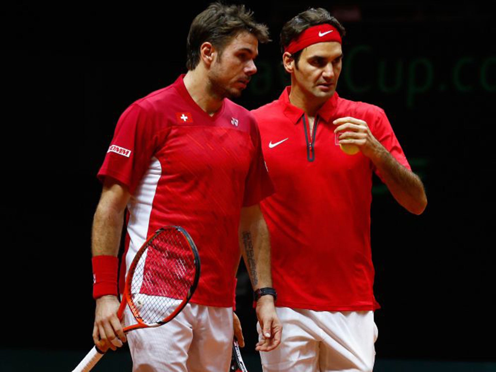 Stan Wawrinka, left, and Roger Federer will play each other for a spot in the US Open final